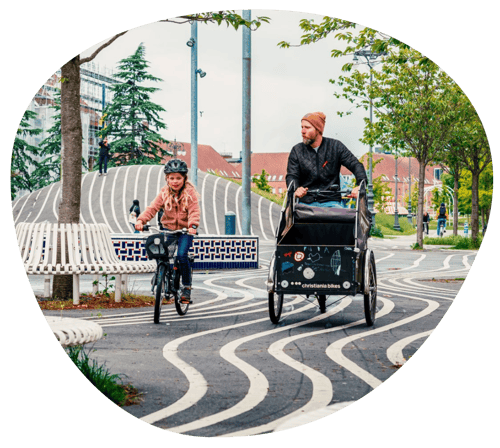 Man on cargo bike with child